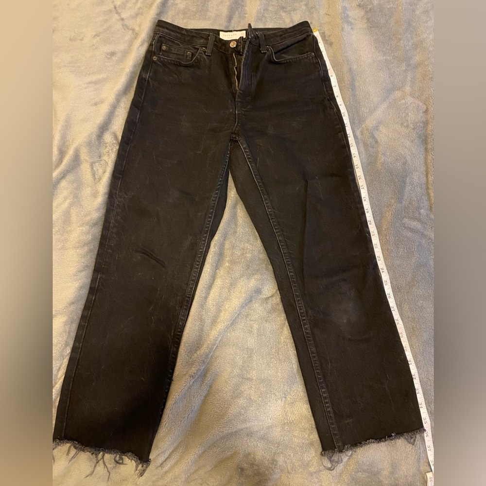 In good condition, worn, thick denim Topshop black wash jeans
